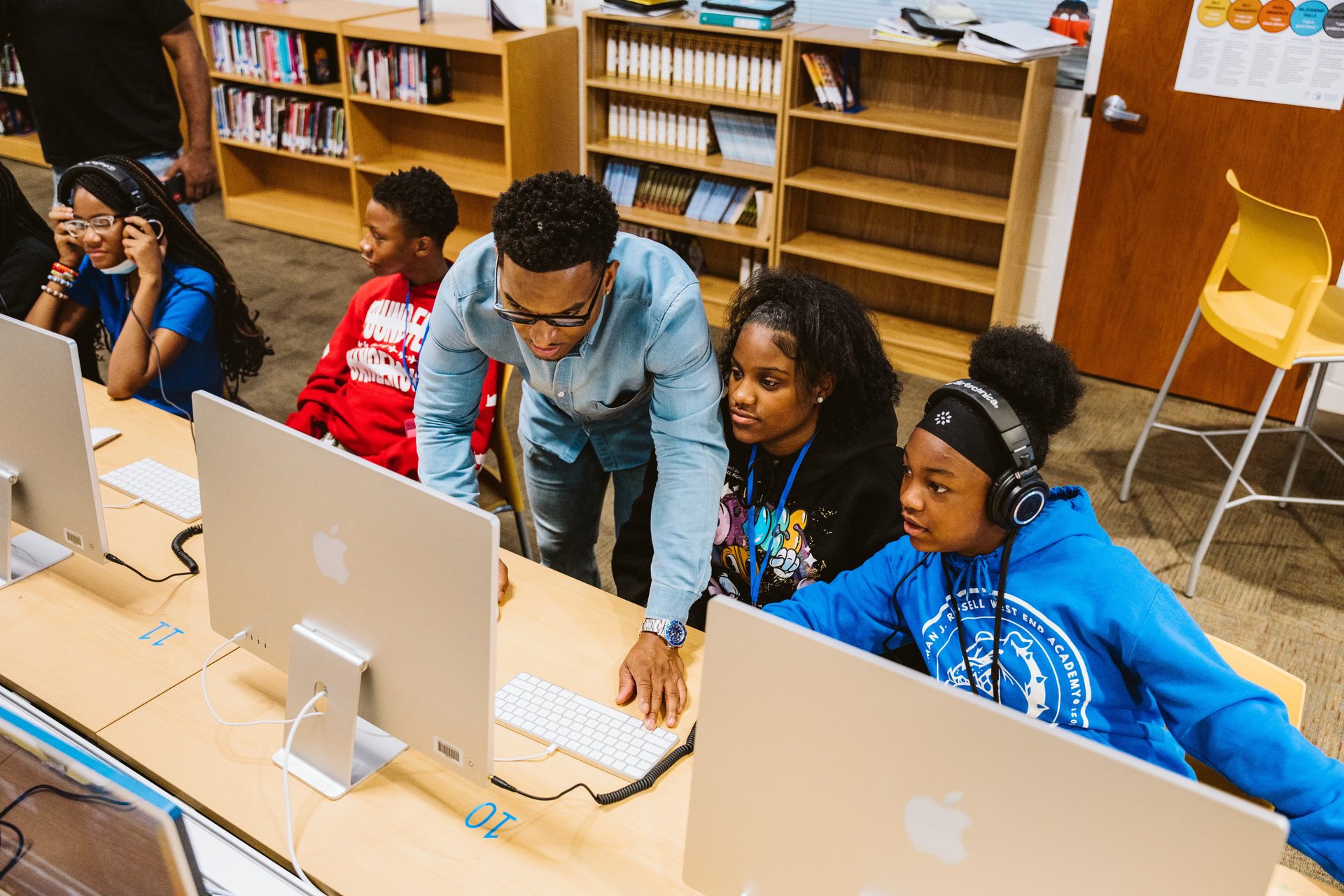 Keyz Bridgez helping students at their computers