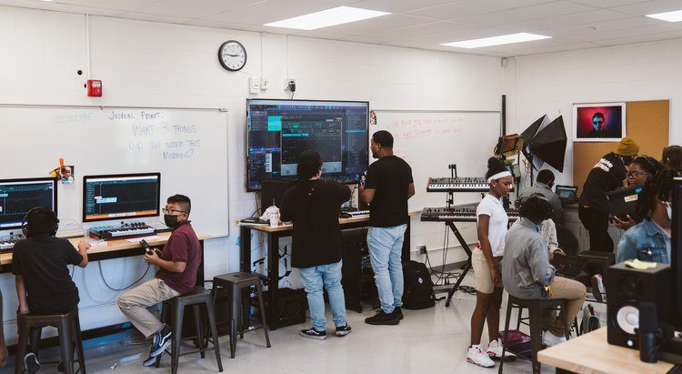 Students at workstations in a music technology classroom
